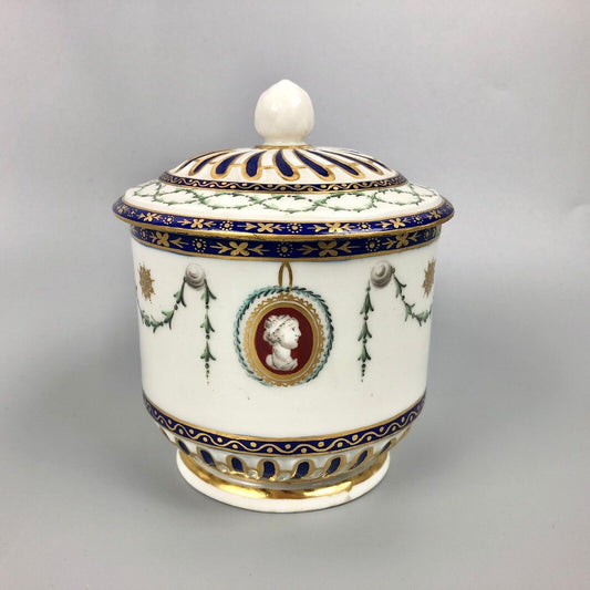 A rare Chelsea-Derby empire-shaped sucrier with classical masks. c.1770