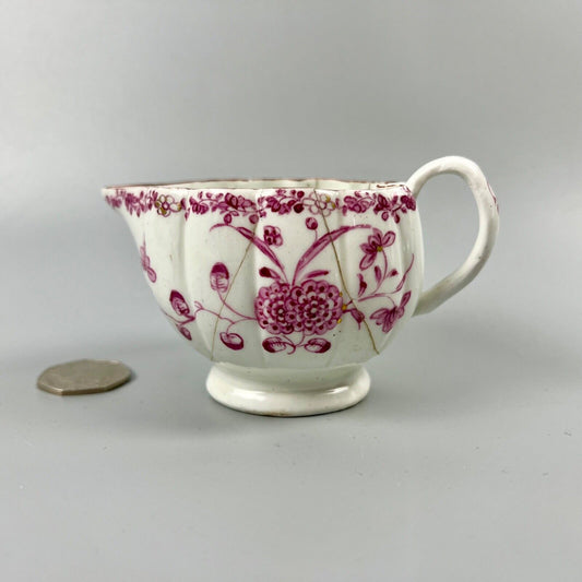 A rare early Derby peach-shaped creamer in 'Banded Hedge' pattern c.1765