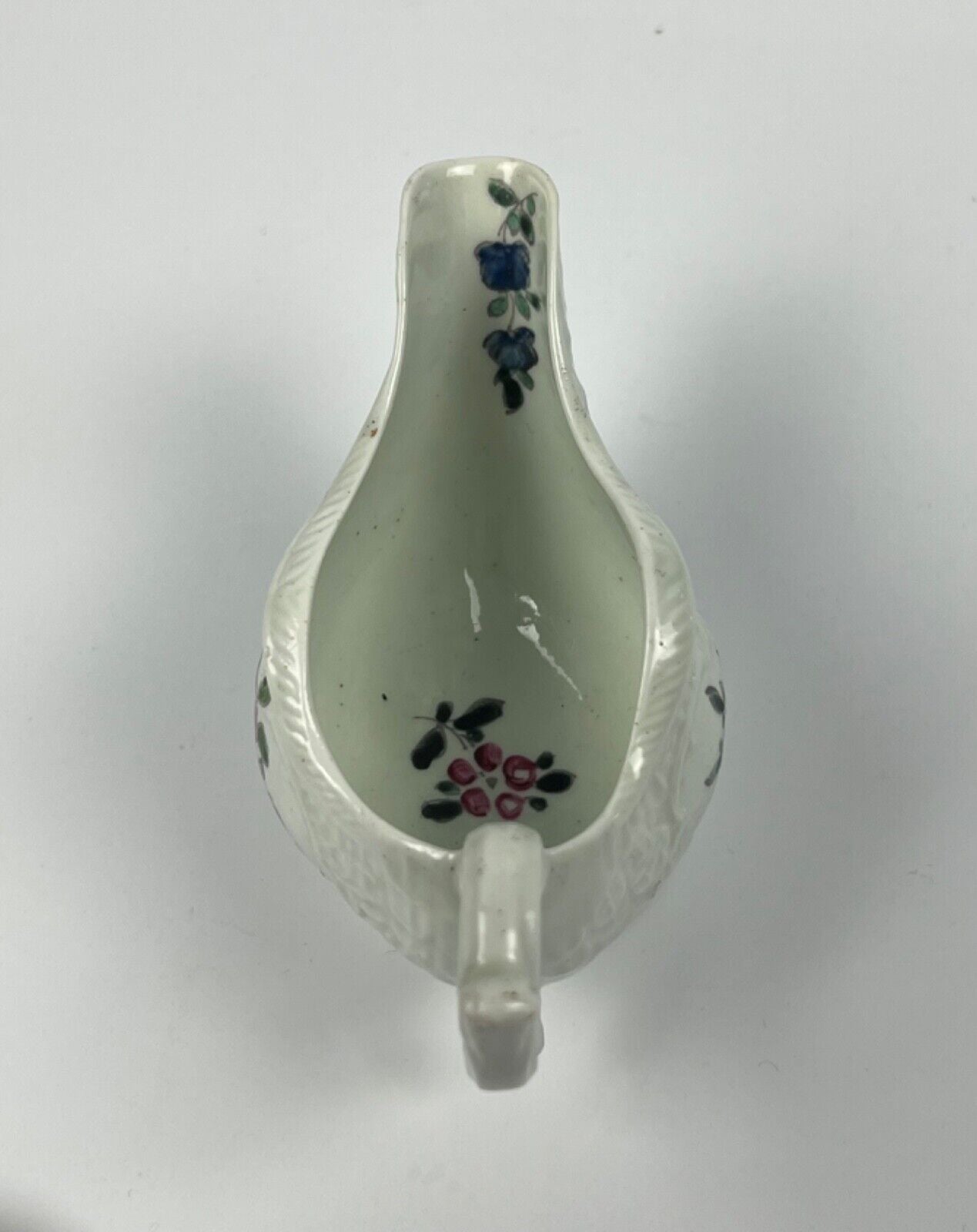A Philip Christian Liverpool moulded polychrome porcelain sauceboat c.1770