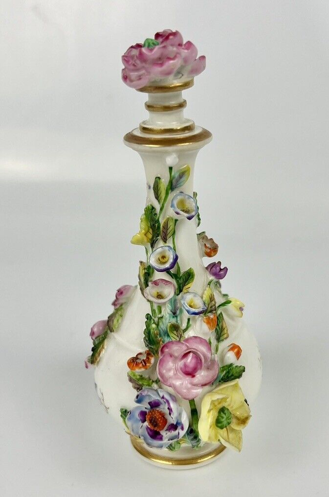 Rockingham porcelain flower encrusted tapered scent bottle. Puce Mark. c.1831-7