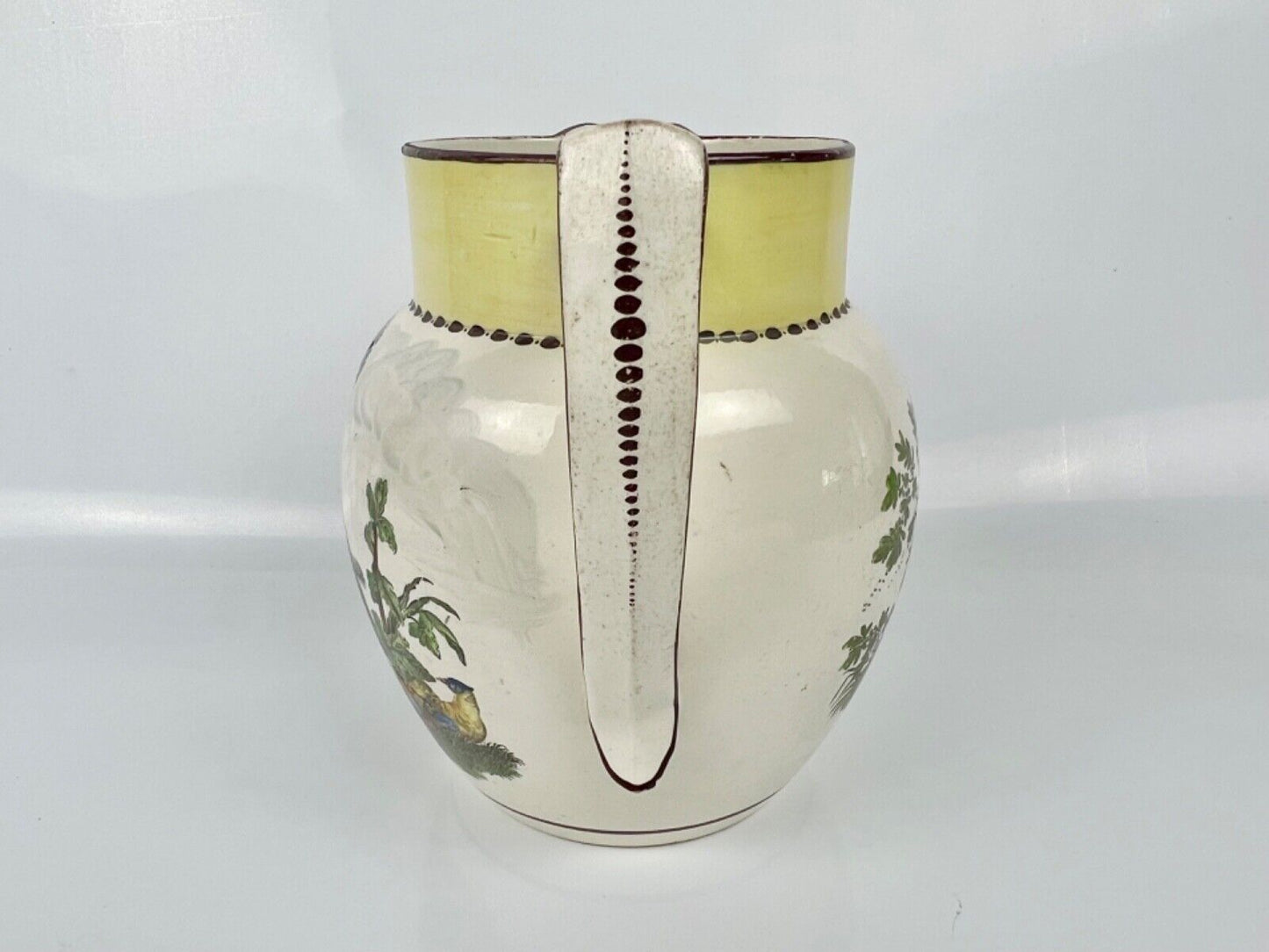 Creamware dated jug printed and painted with a dog and birds. c.1812, 'Wm Read'