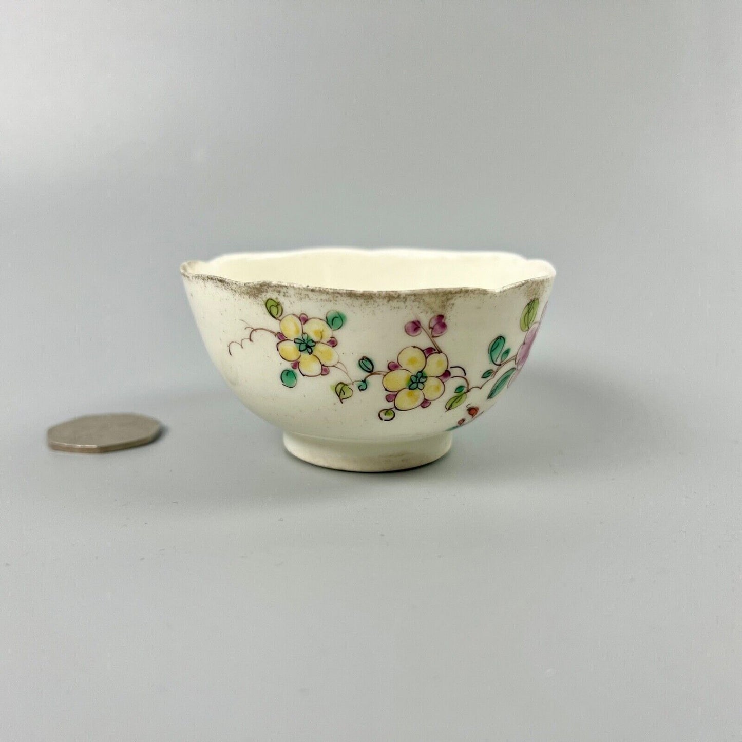 An unusual Bow teabowl painted with famille rose floral sprays c.1750-3