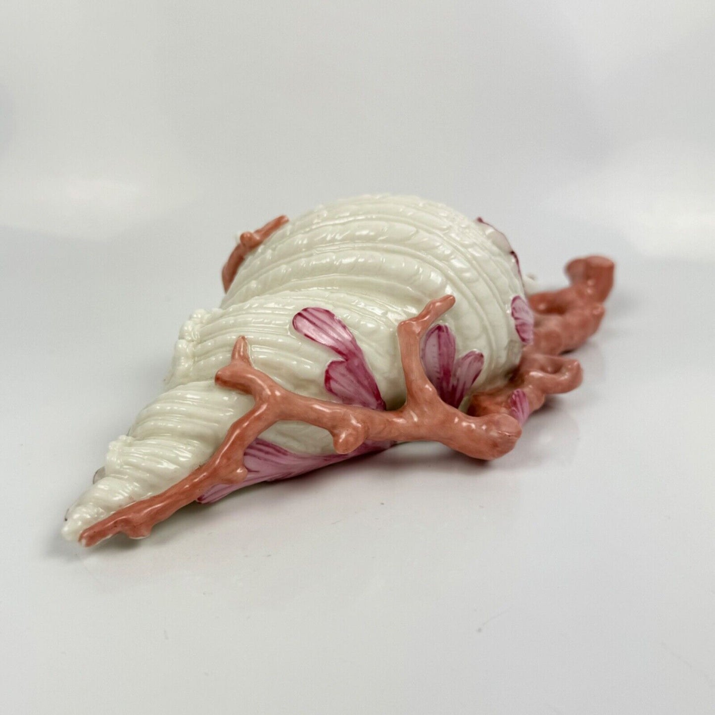 A 19thc Royal Worcester coral and shell wall pocket.