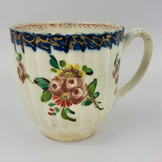 A Seth Pennington fluted coffee cup with blue and gilt border .1780-90