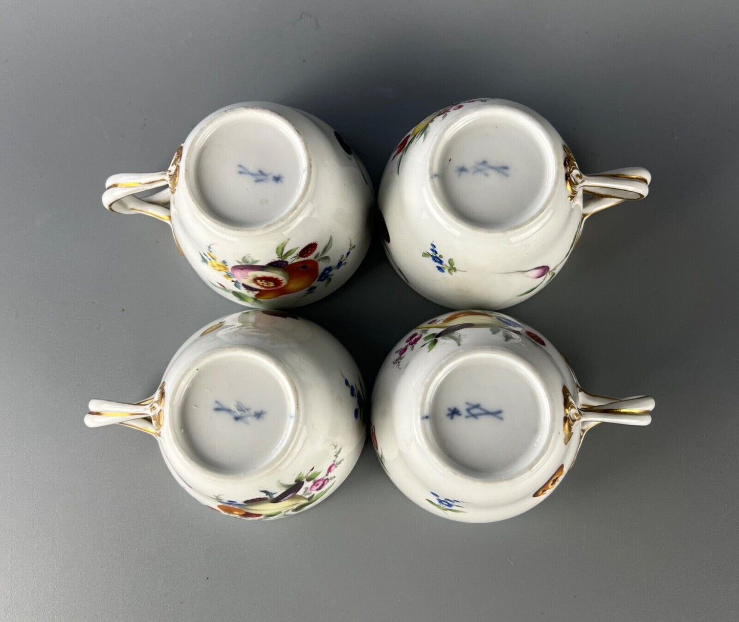 A set of four Meissen Marcolini Period c.1800 bifurcated-handle coffee cups.