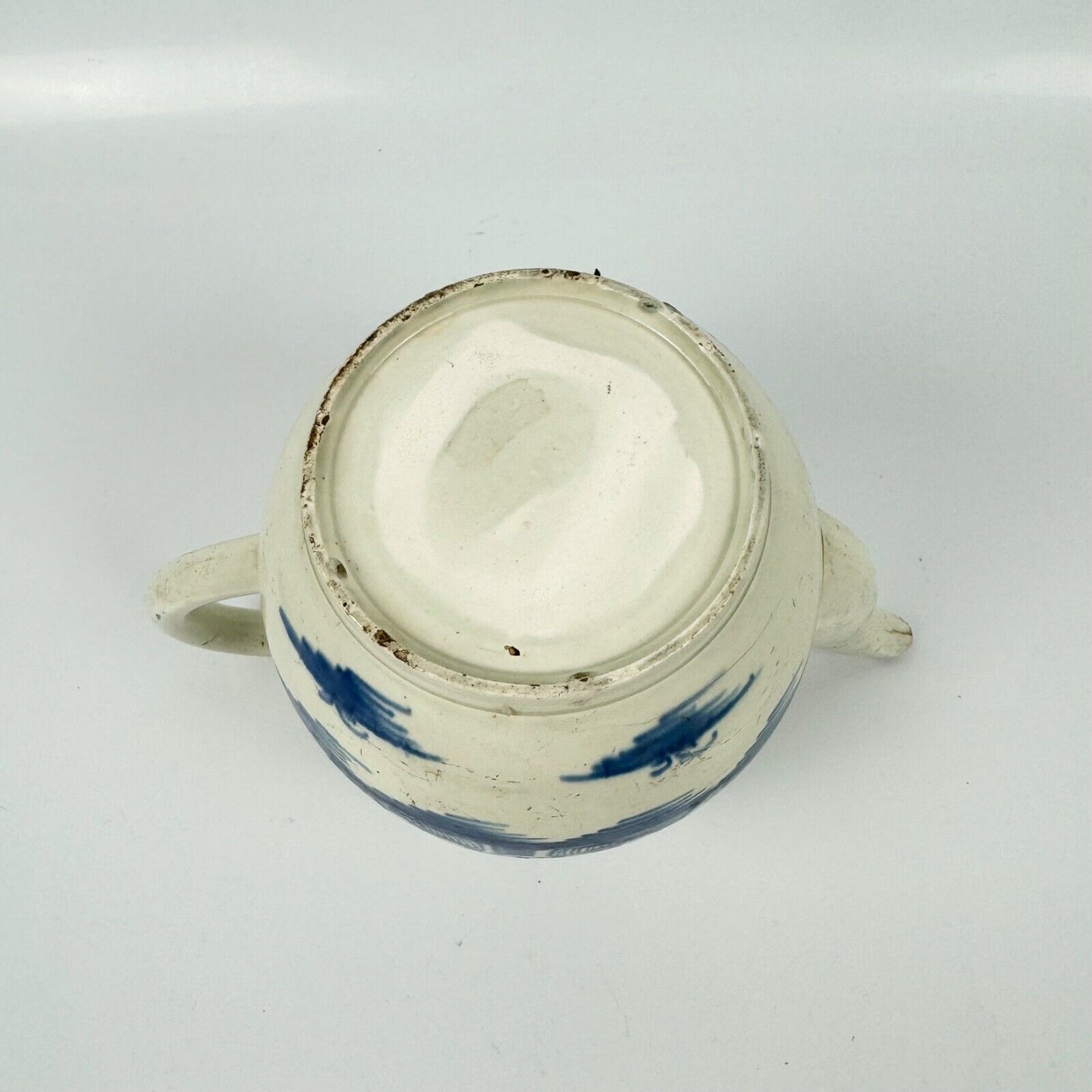 A Staffordshire c1790 hand-painted with a chinoiserie scene pearlware teapot.