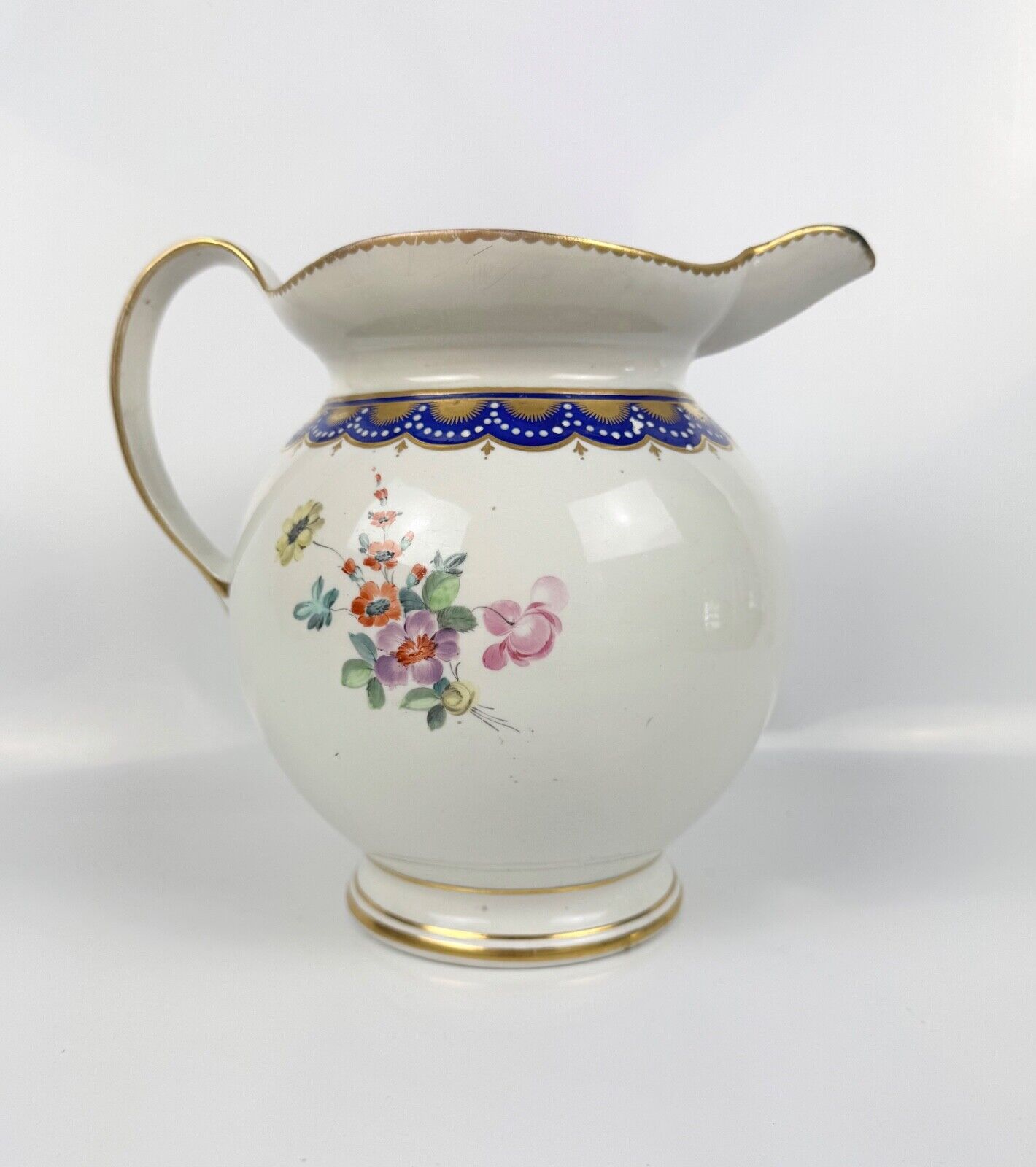 A rare Derby ewer  Smith's blue rim and  painted with flowers by Withers. c.1780