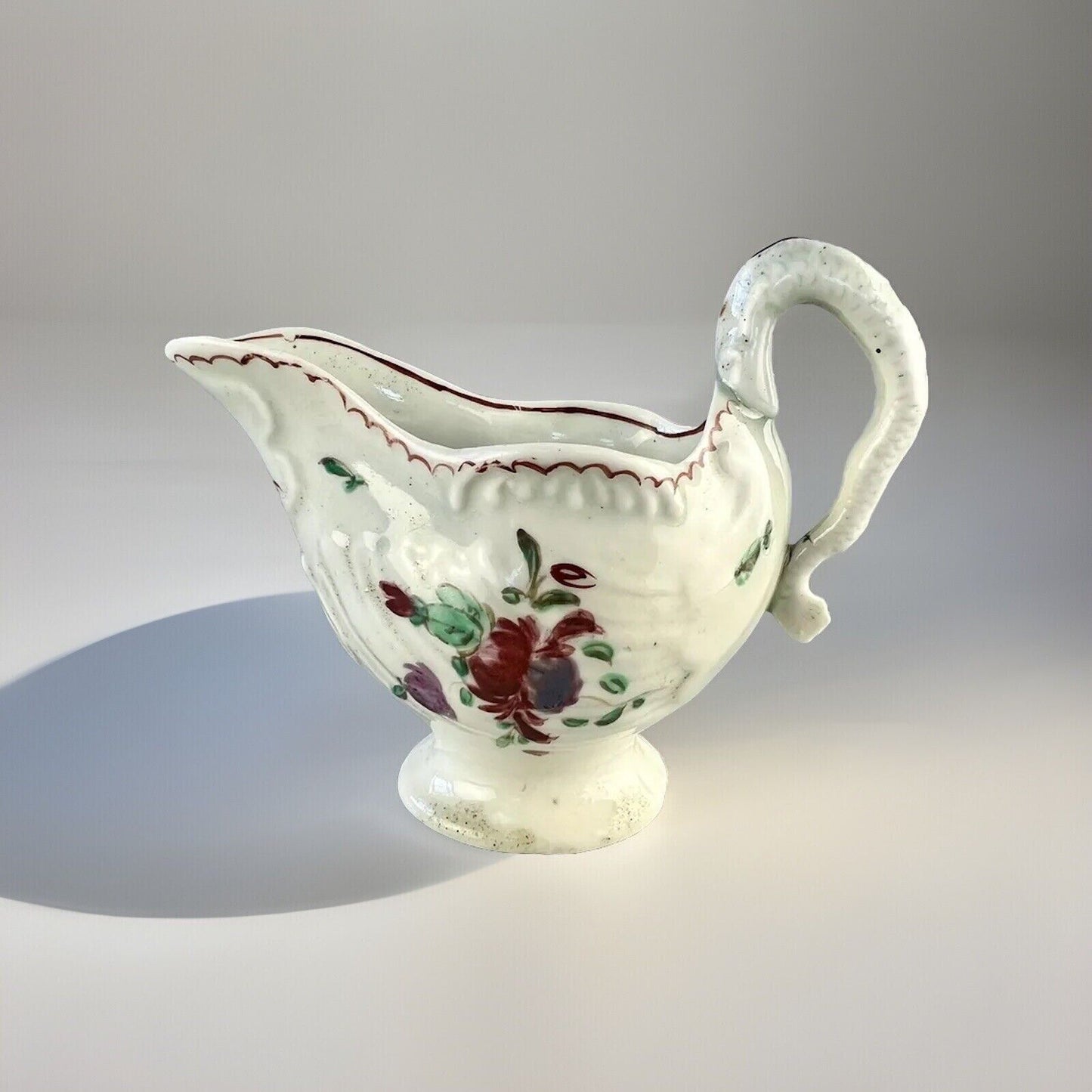 A Philip Christian Liverpool porcelain lamprey handled cream jug c.1775