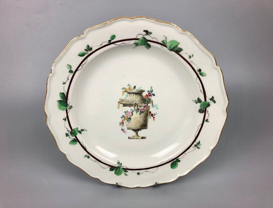 A James Giles decorated 1st Period Worcester plate painted with an urn c.1770