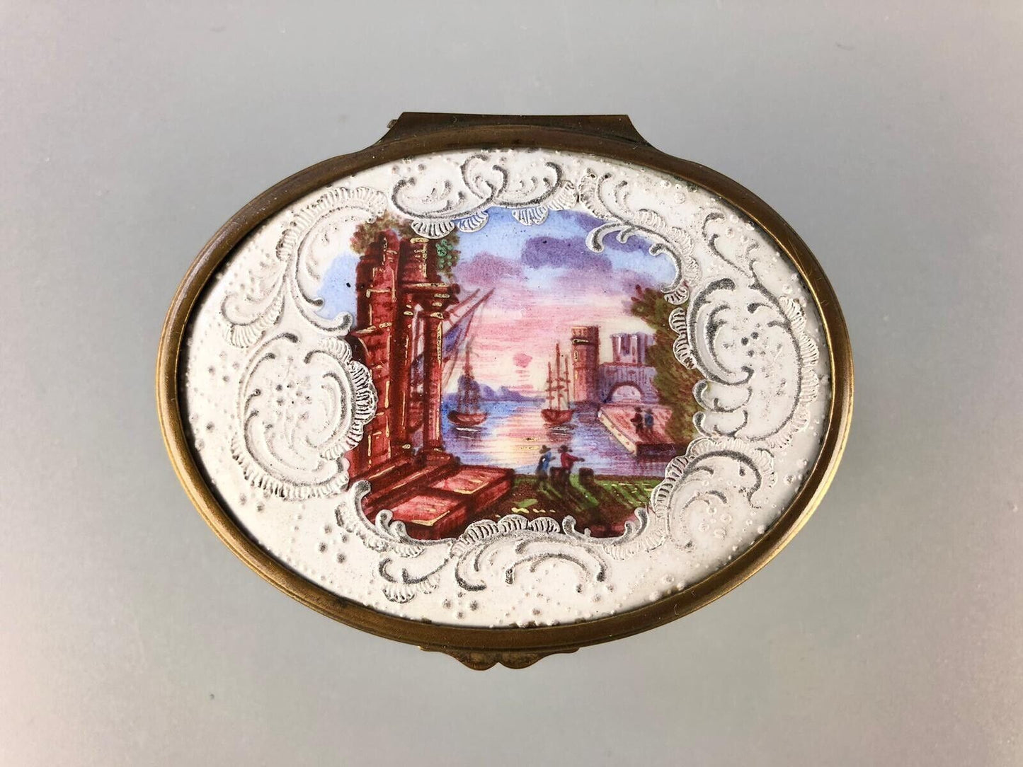 A superb 1775 enamel on copper table snuff box painted with harbour scenes.