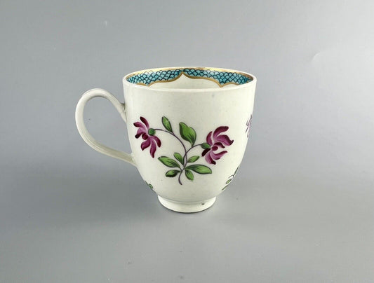A 1st Period Worcester polychrome coffee cup c1770. Sprung handle.