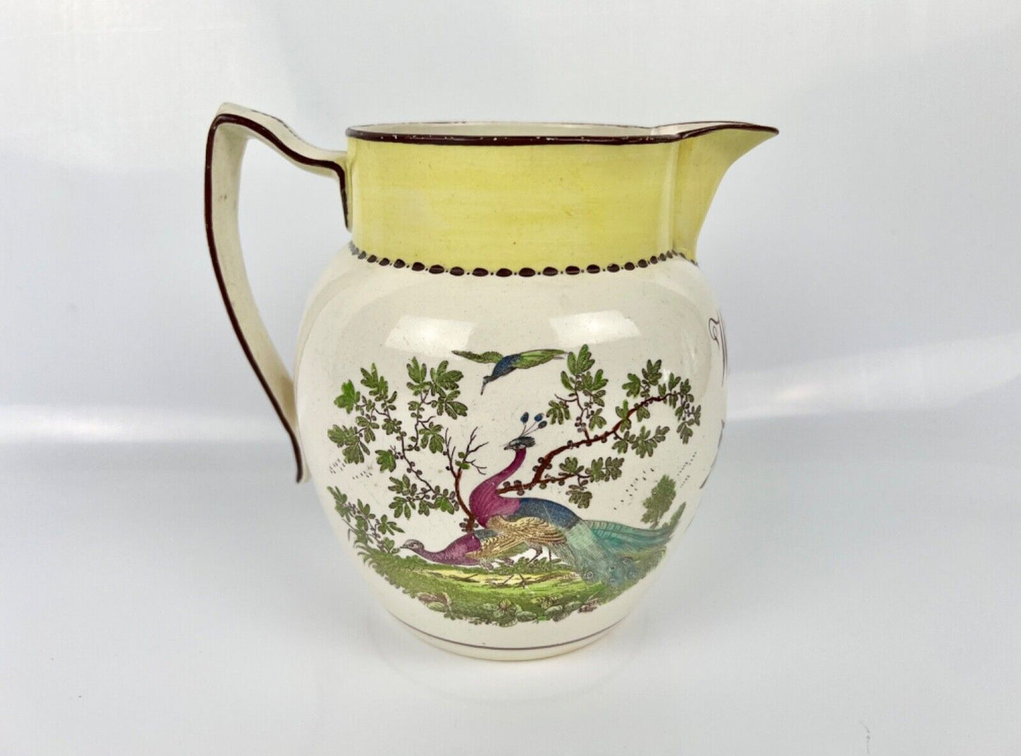 Creamware dated jug printed and painted with a dog and birds. c.1812, 'Wm Read'
