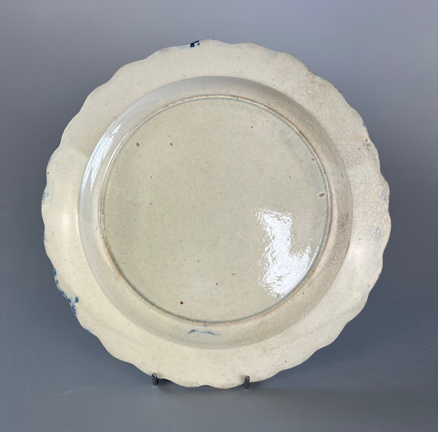 A c.1790-1810 shell moulded pearlware plate with painted floral decoration.#1