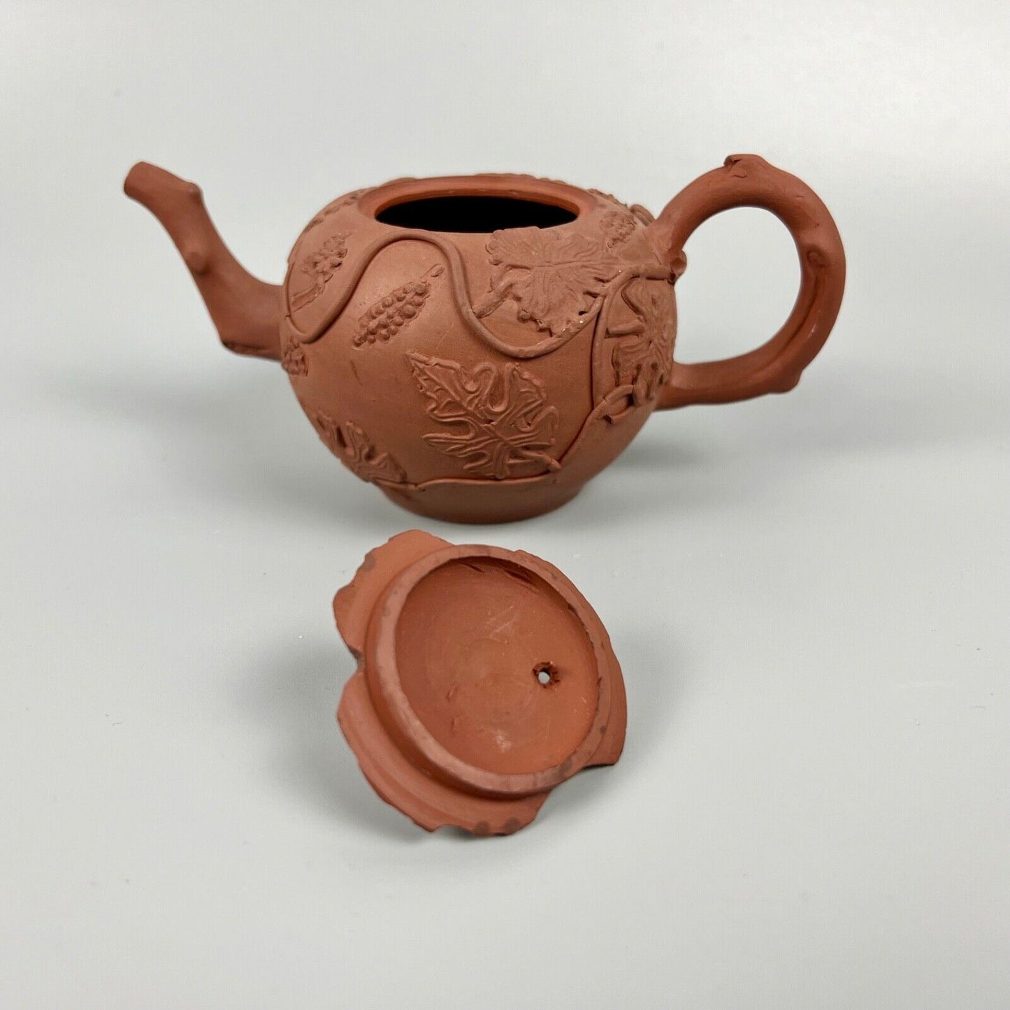 A Diminutive Staffordshire red stoneware teapot with sprigged decoration c.1760