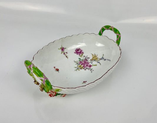 A good Chelsea basketweave moulded basket painted with bouquets. Rustic handles