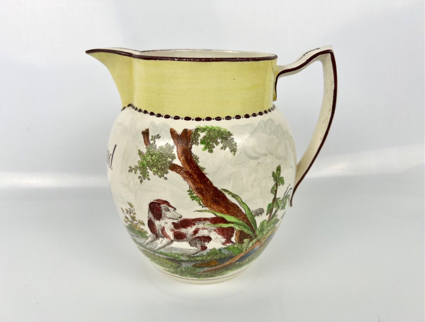 Creamware dated jug printed and painted with a dog and birds. c.1812, 'Wm Read'