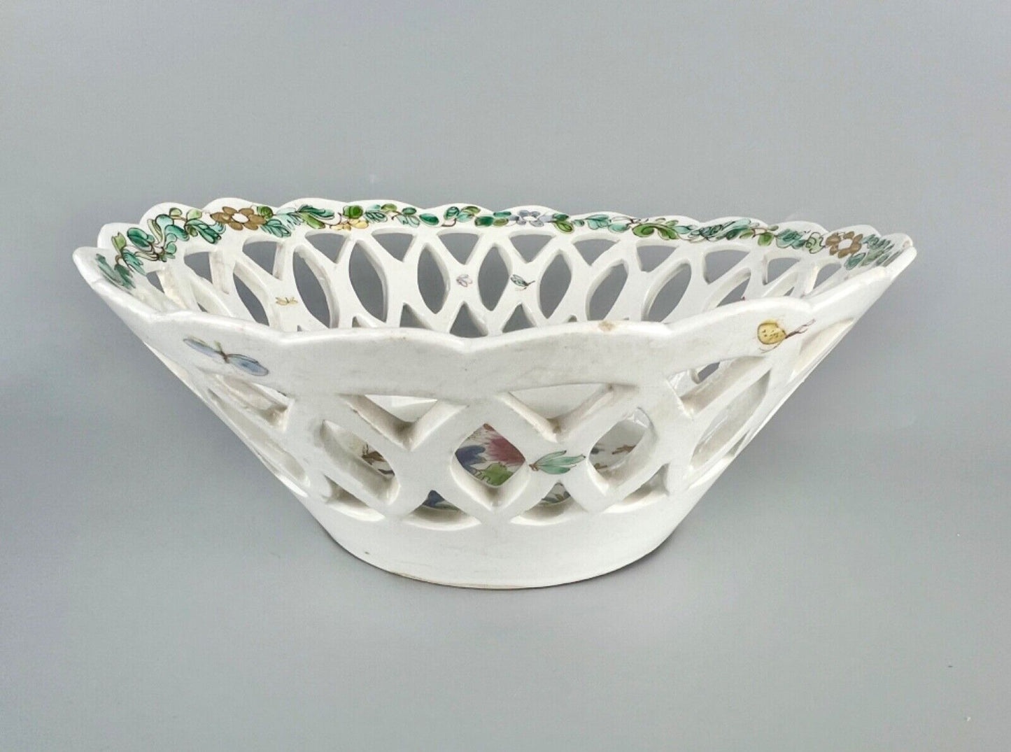 A fine and early Bow porcelain famille rose reticulated basket c.1752