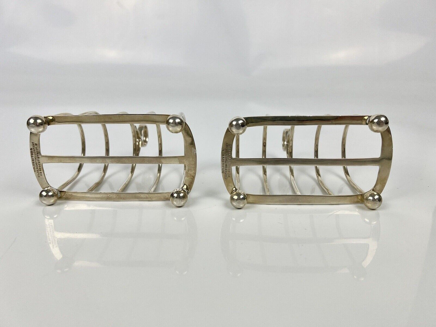 A Pair Of Goldsmith And Silversmith's Company Toastracks. Sheffield 1935.