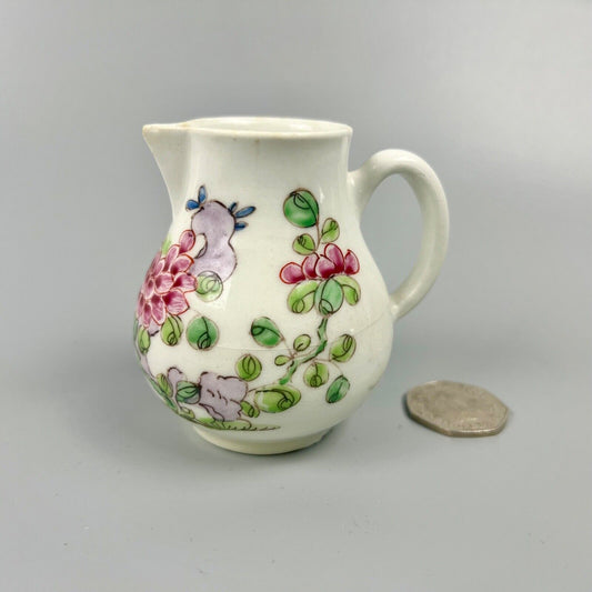 An early Bow creamer painted in famille rose style c1750-3