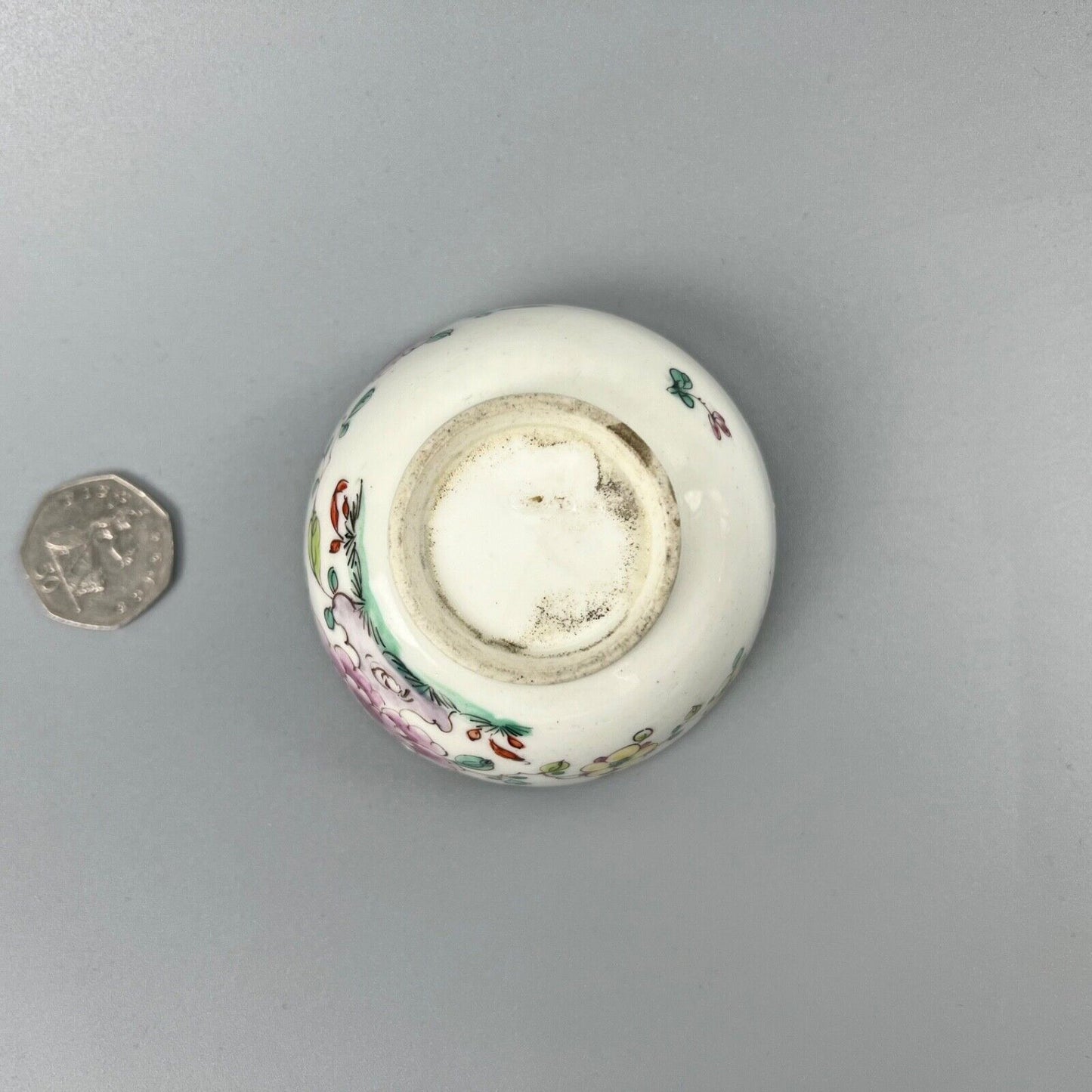 An unusual Bow teabowl painted with famille rose floral sprays c.1750-3