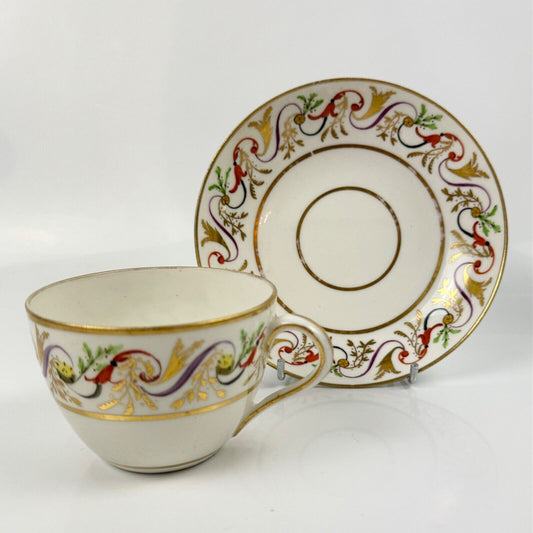 A good Pinxton tea cup and saucer c1796-9 in pattern 301.