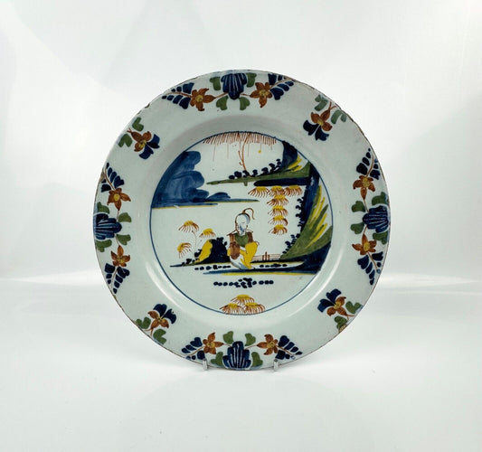 A Lambeth (Abigail Griffiths) delft plate, c.1760, painted in polychrome enamels