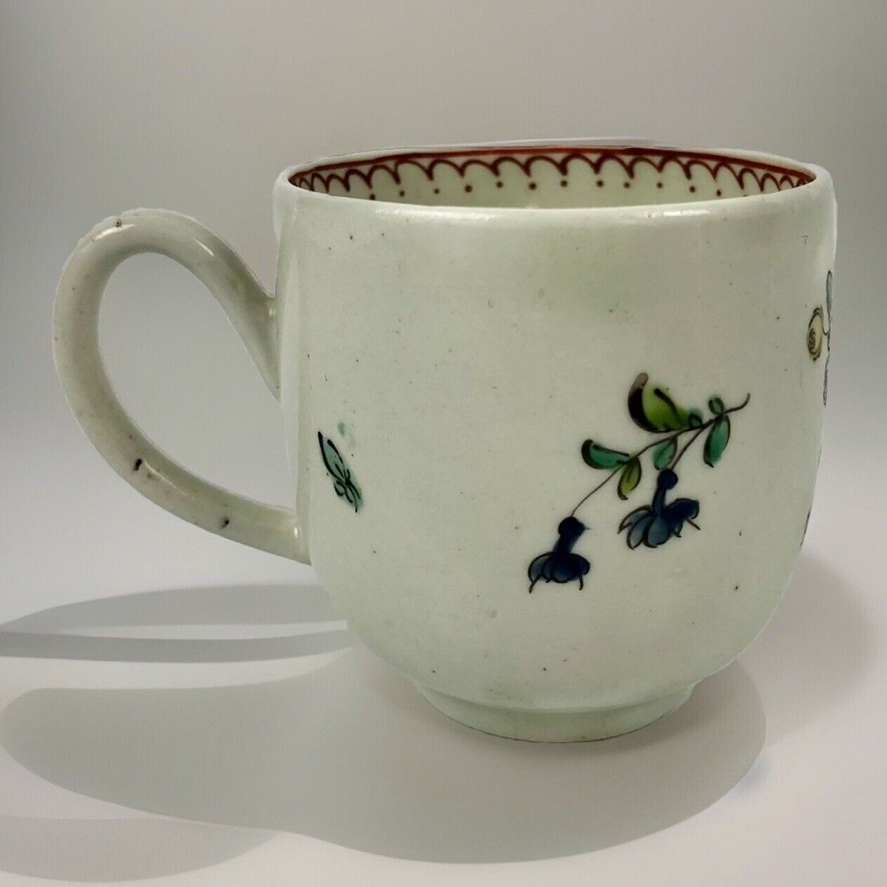 A c.1765-75 Liverpool Philip Christian polychrome floral painted coffee cup