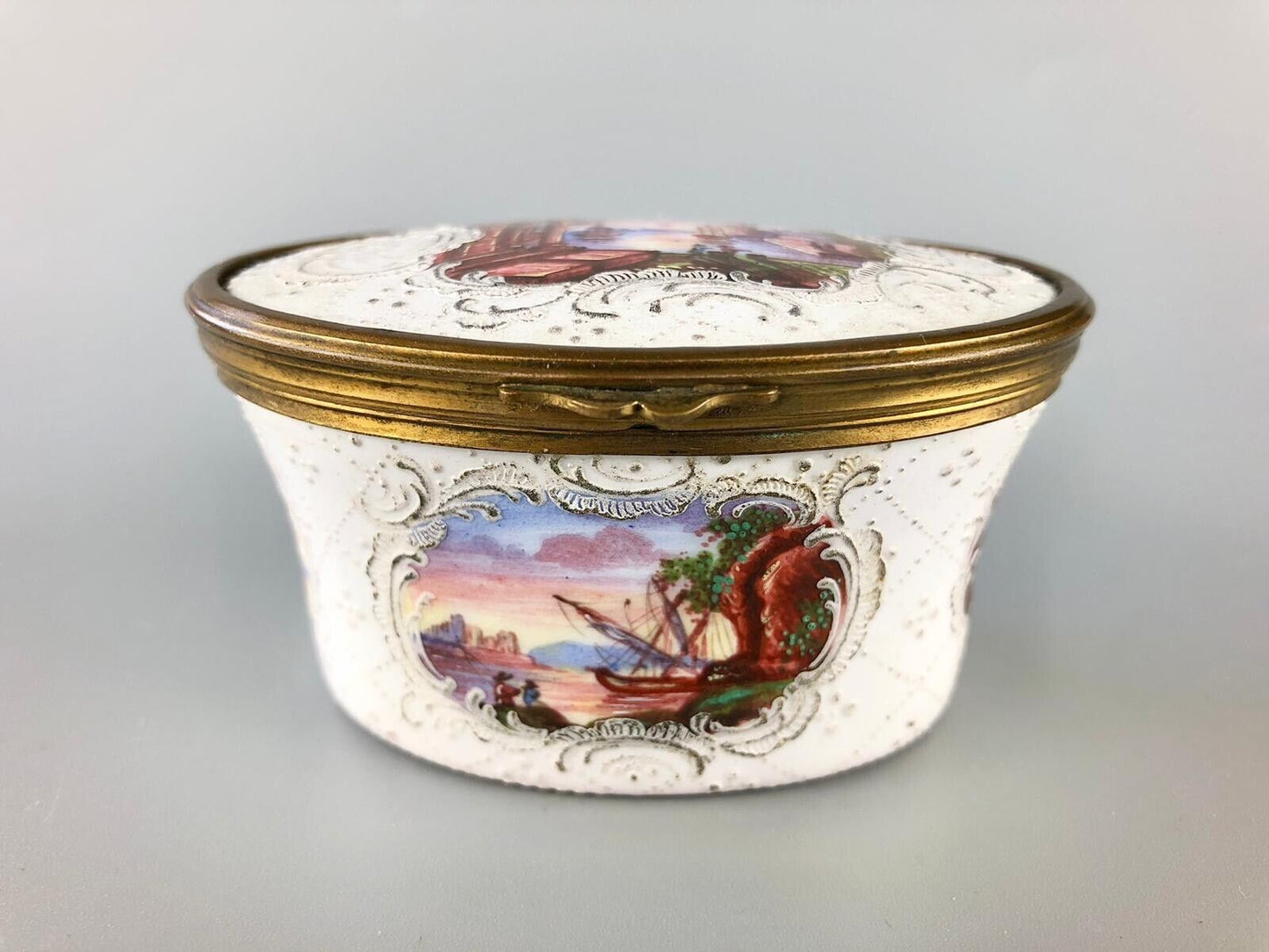 A superb 1775 enamel on copper table snuff box painted with harbour scenes.