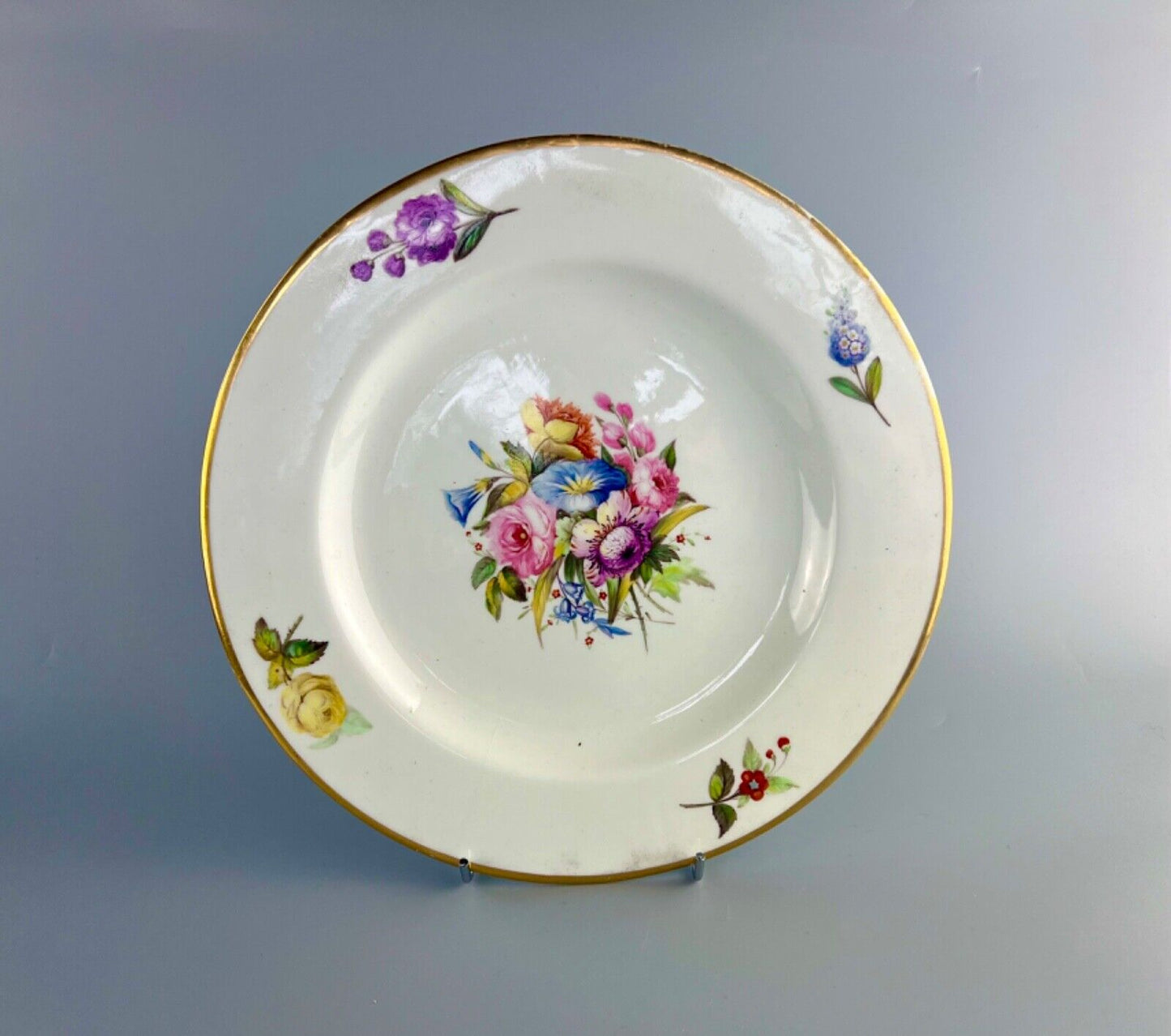 An early 19thc Derby floral-painted (probably by Leonard Lead) plate.