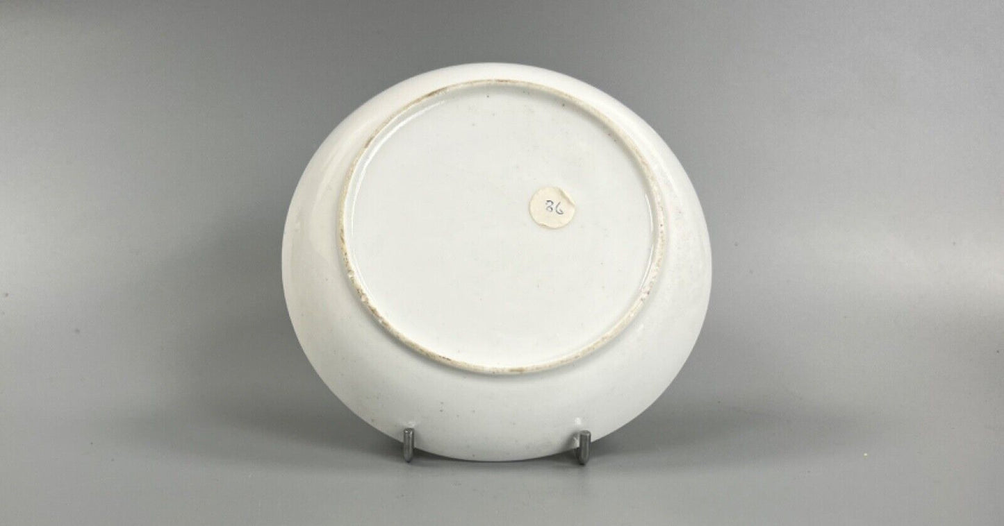 An early 19thc bute shape New Hall cup and saucer in pattern number 1152