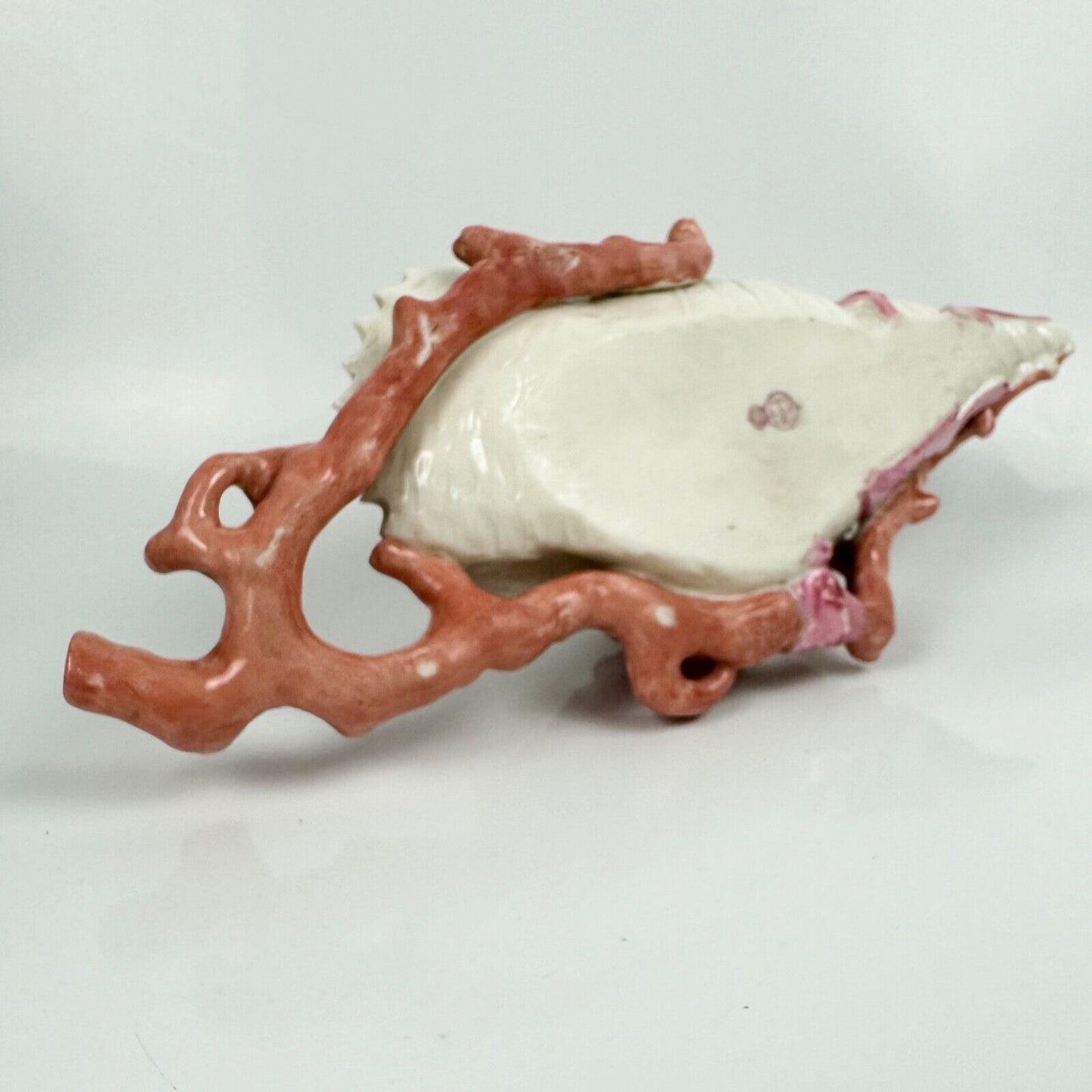 A 19thc Royal Worcester coral and shell wall pocket.