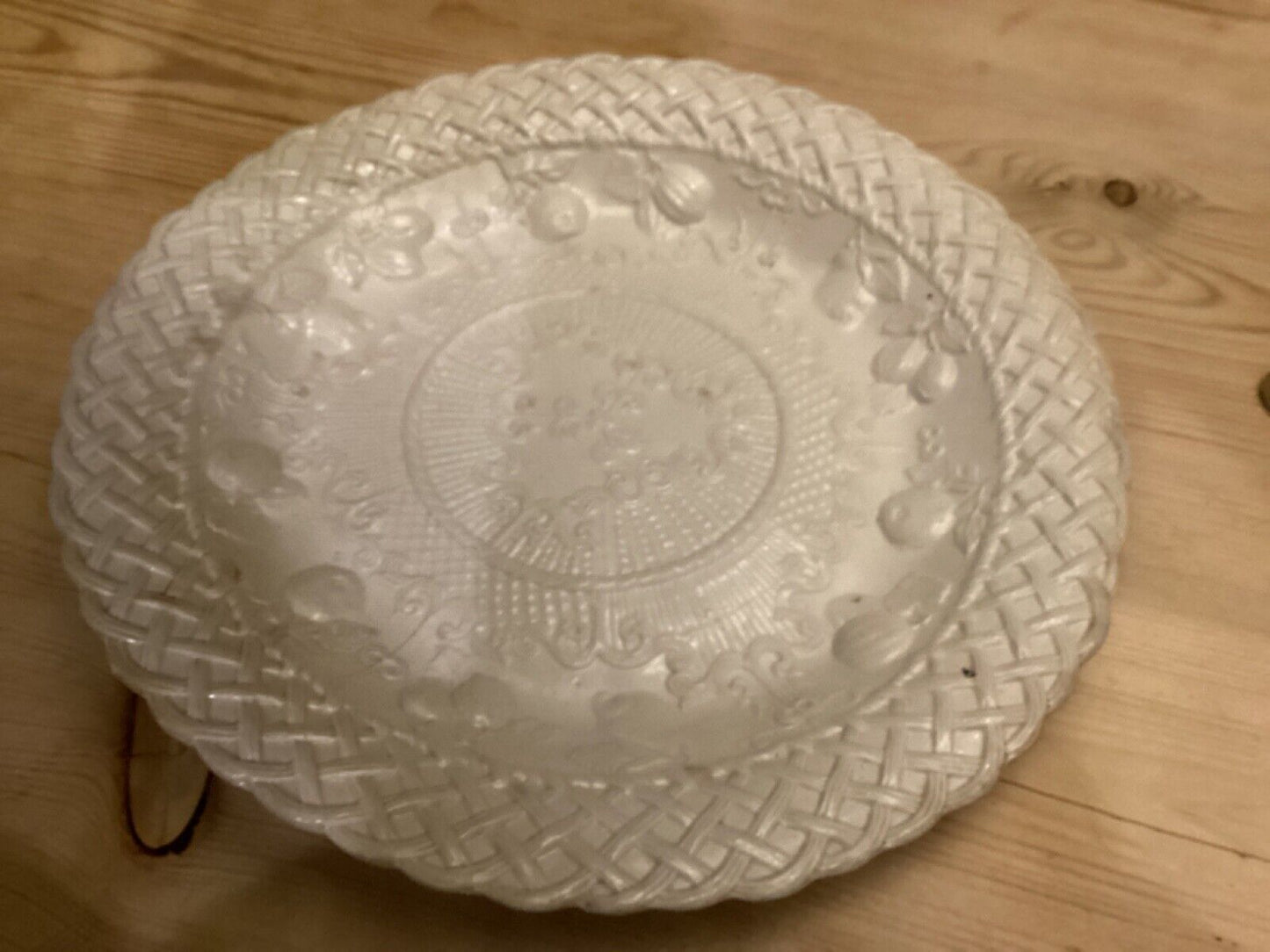A superb salt glazed stoneware plate. Basketweave and fruit moulding. c.1760