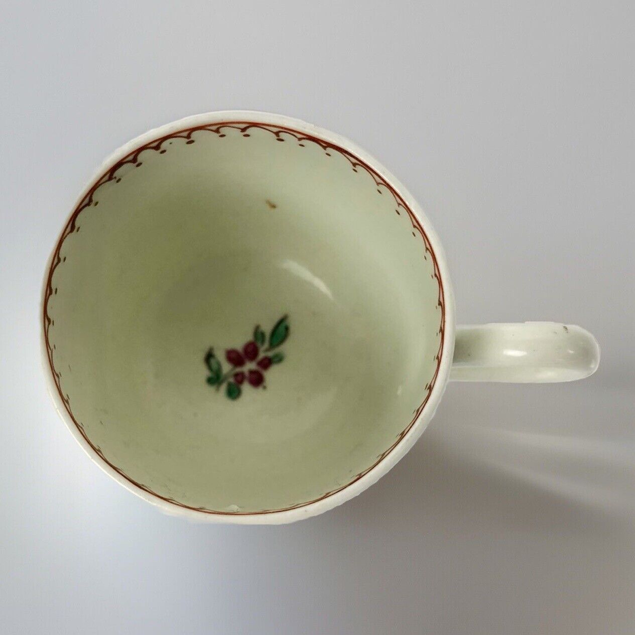 A c.1765-75 Liverpool Philip Christian polychrome floral painted coffee cup