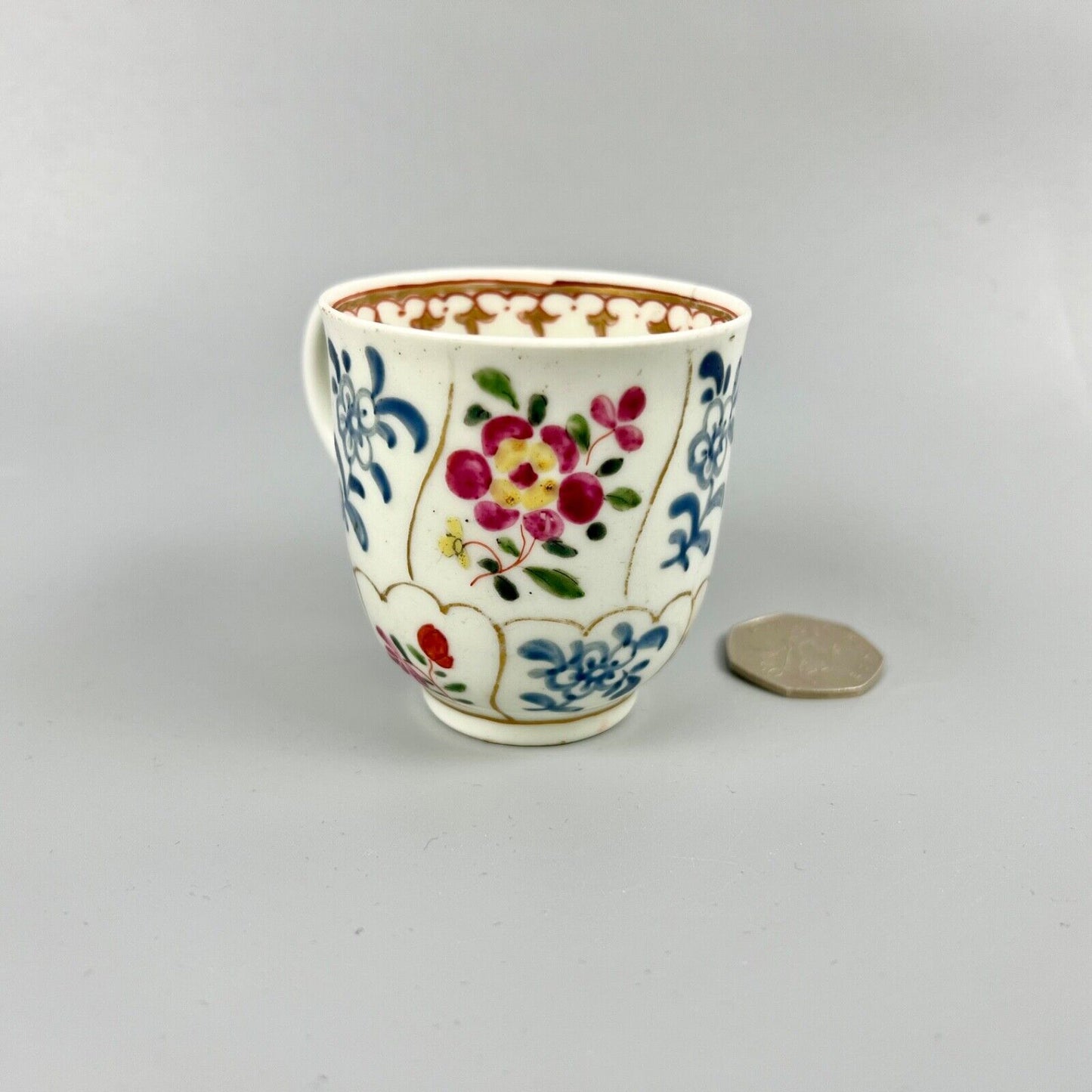 1st Period Worcester outside decorated coffee cup. Gilt trellis inner rim. c1770