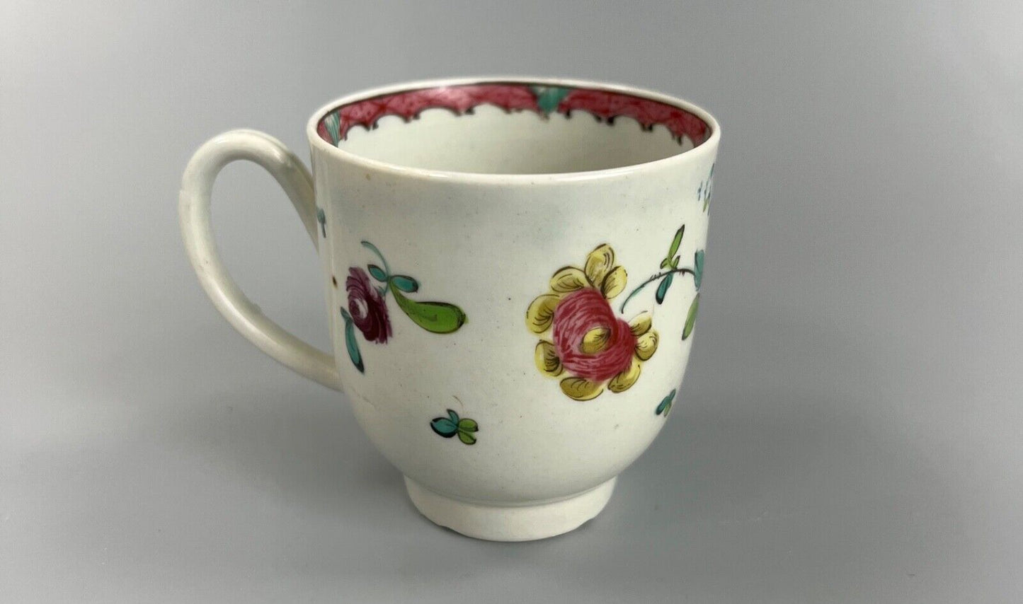 A Seth Pennington Liverpool coffee cup w/painted border & floral decoration