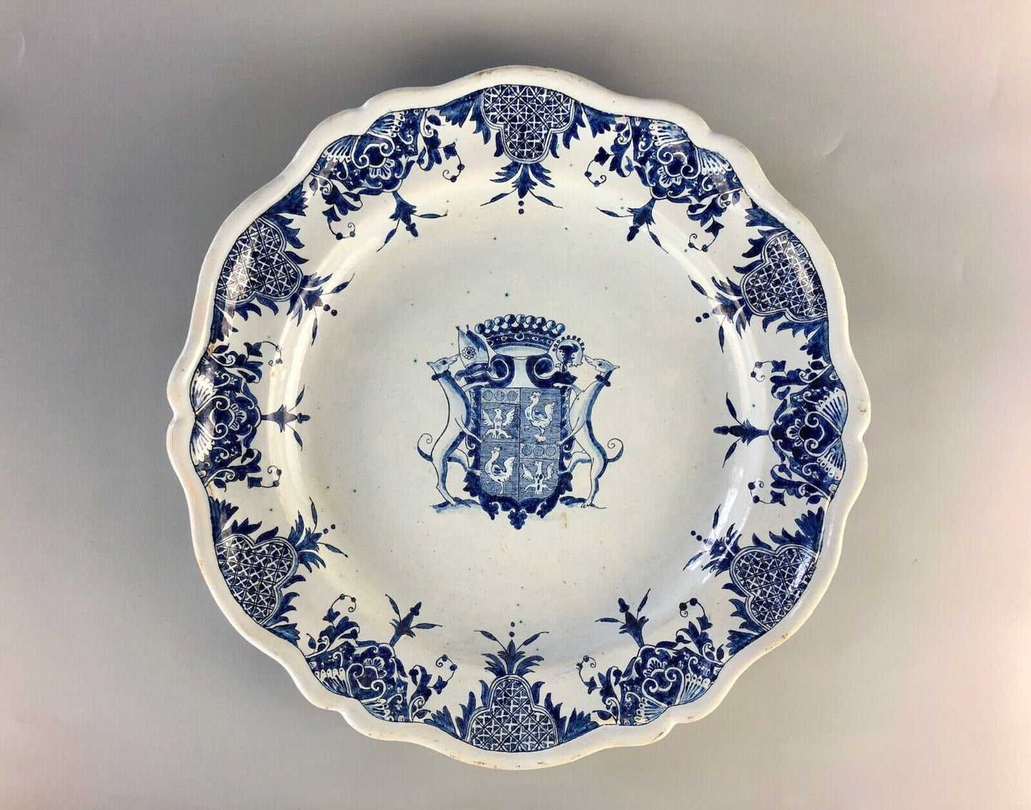 A magnificent and large armorial Rouen faience charger plate. 19thc.