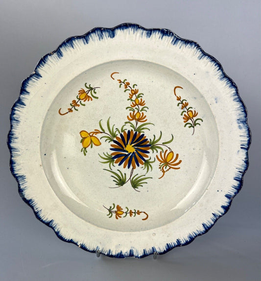 A c.1790-1810 shell moulded pearlware plate with painted floral decoration.#2