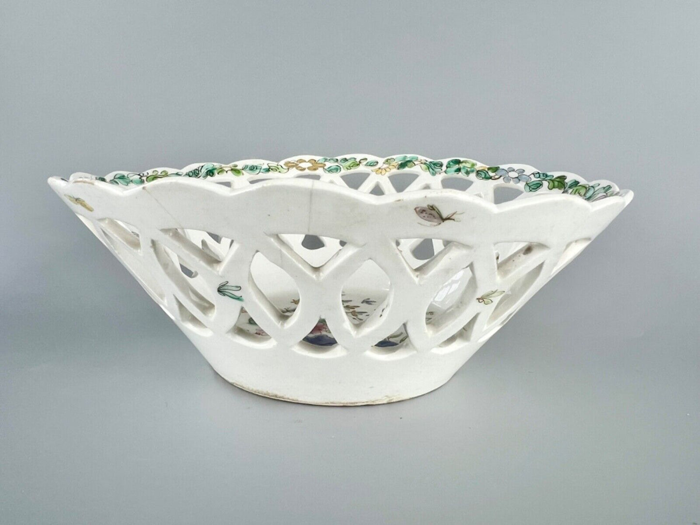 A fine and early Bow porcelain famille rose reticulated basket c.1752