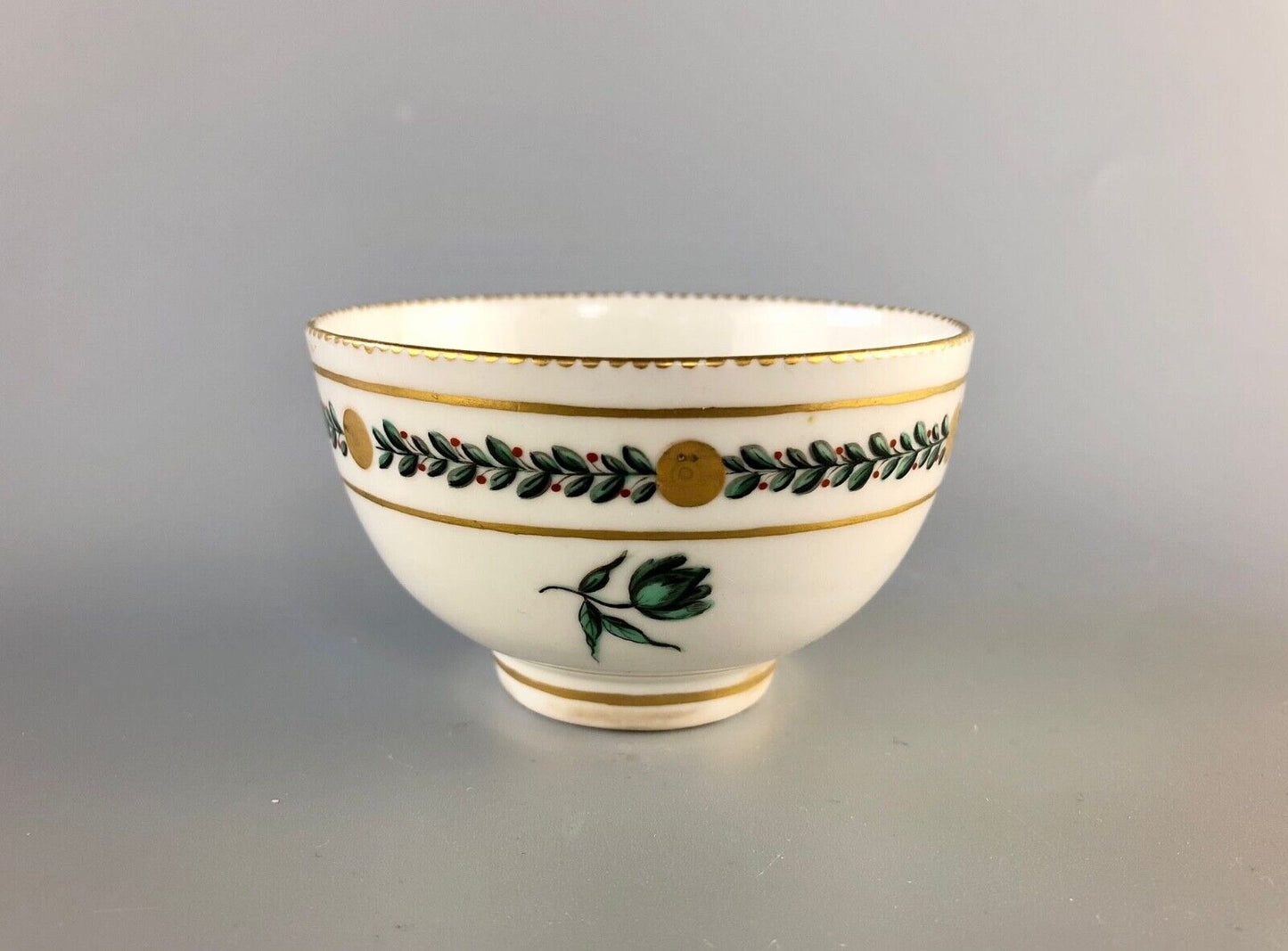 A c. 1775 Chelsea-Derby Porcelain tea bowl enamelled with foliate motifs