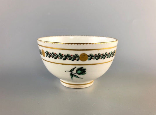 A c. 1775 Chelsea-Derby Porcelain tea bowl enamelled with foliate motifs