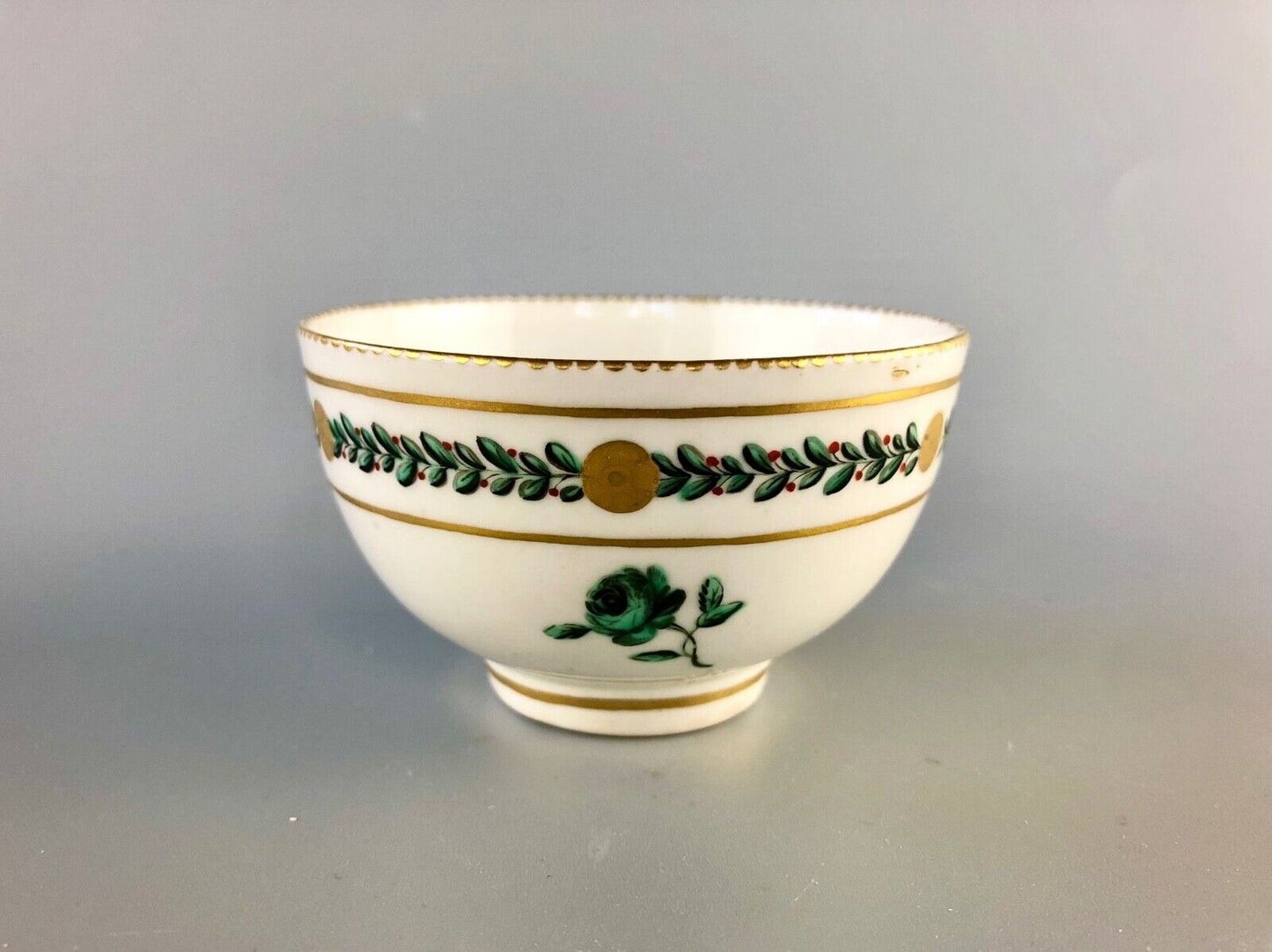 A c. 1775 Chelsea-Derby Porcelain tea bowl enamelled with foliate motifs