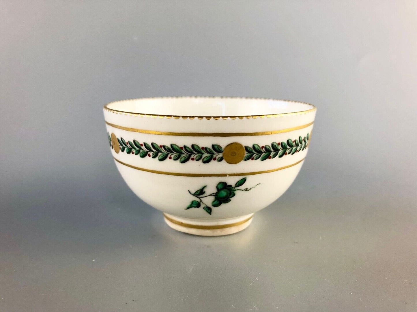 A c. 1775 Chelsea-Derby Porcelain tea bowl enamelled with foliate motifs