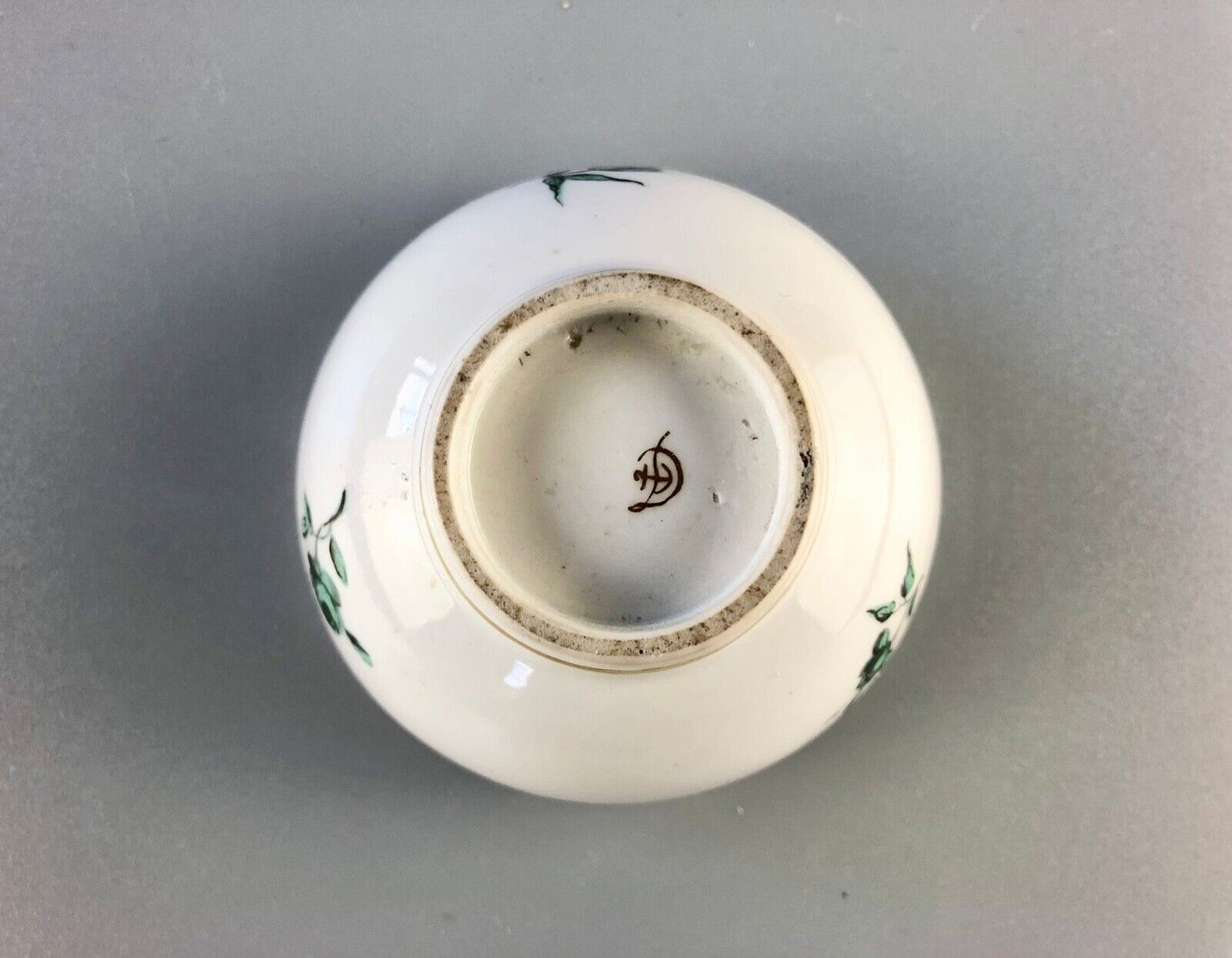 A c. 1775 Chelsea-Derby Porcelain tea bowl enamelled with foliate motifs